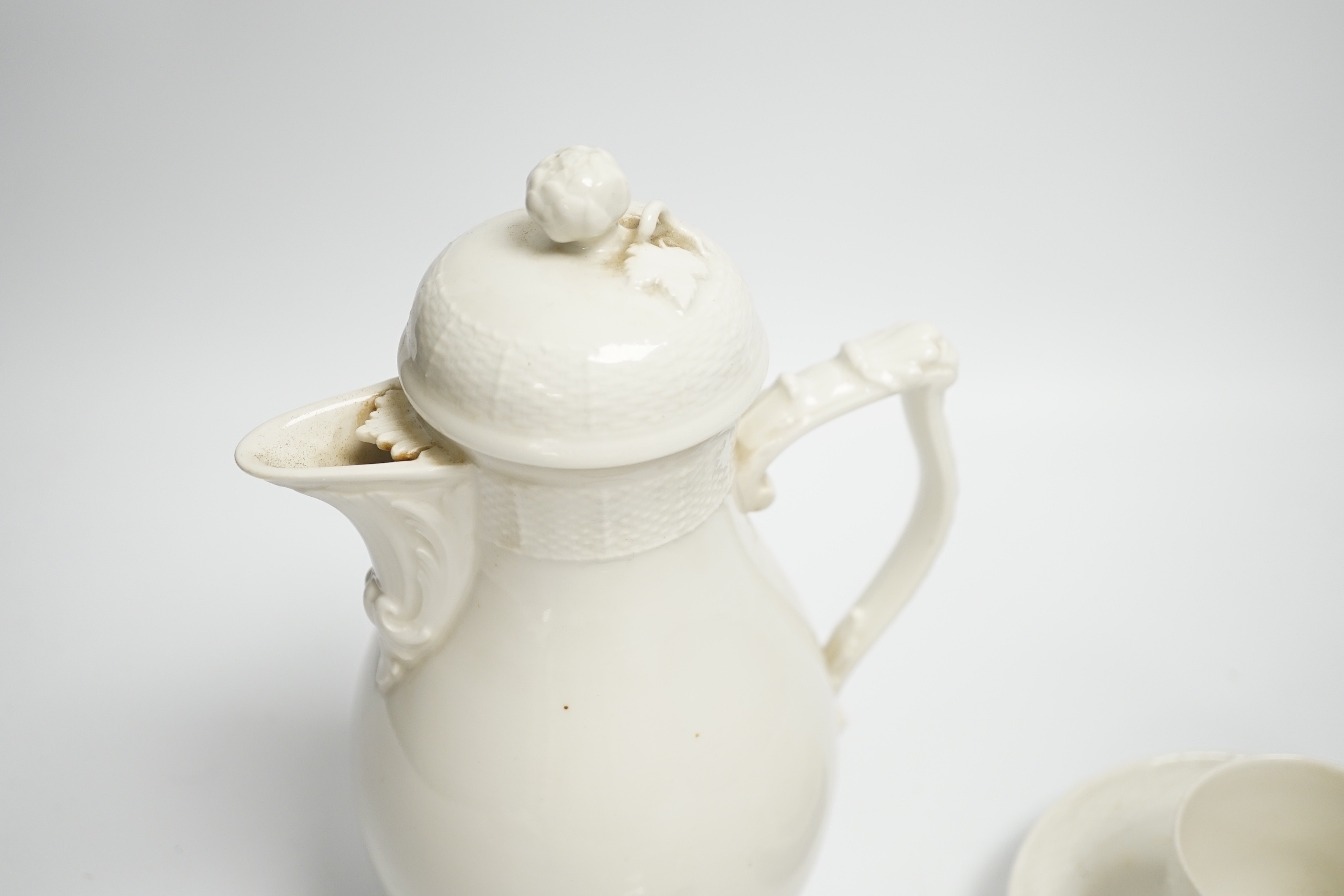 An early 20th century Berlin white glazed porcelain coffee set, tallest 21cm